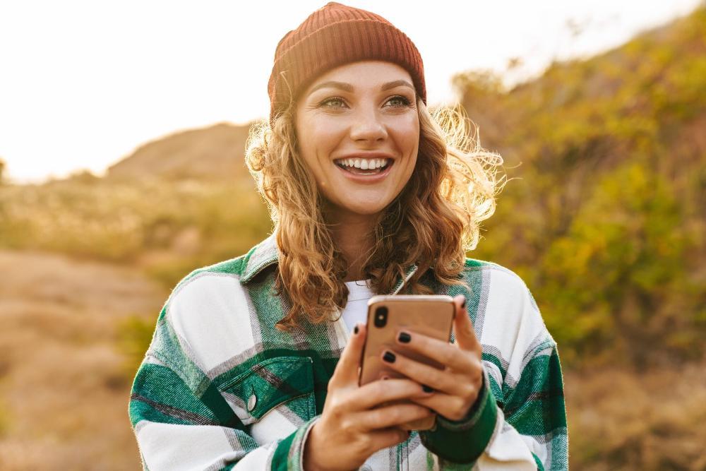 Woman smiling while on phone