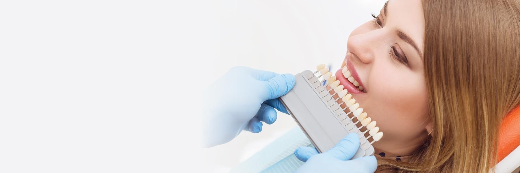 Woman getting teeth whitened