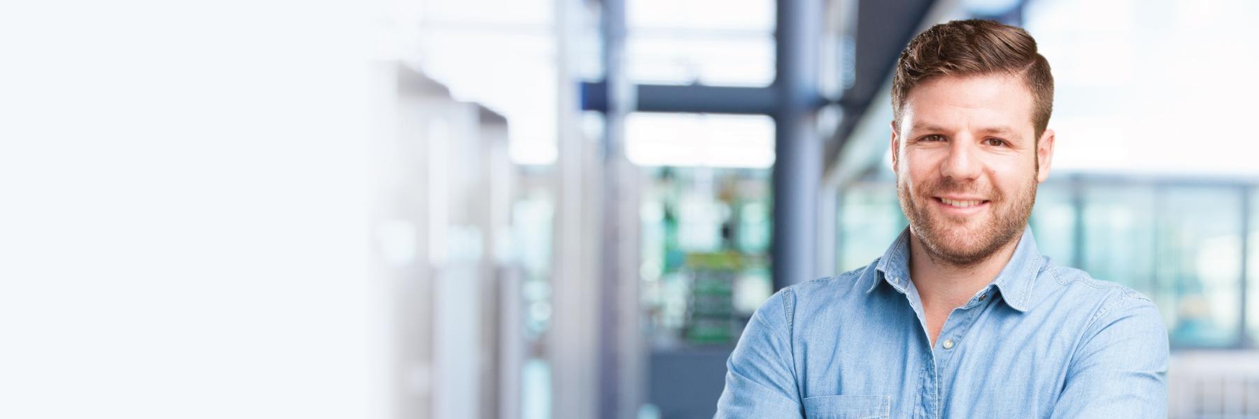 Man smiling in office 