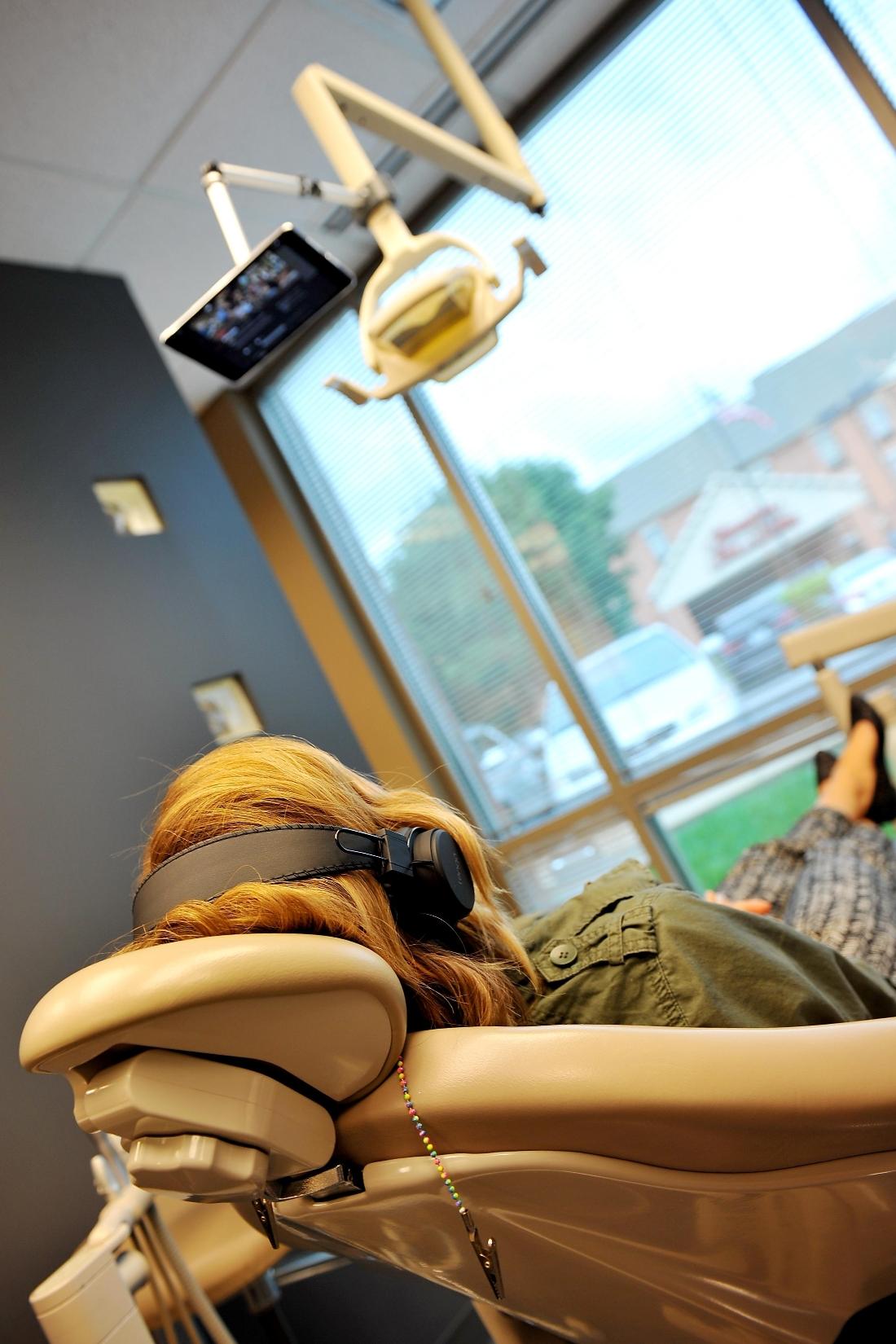 Woman sitting in dental chair during exam at Chesterfield Valley Dental